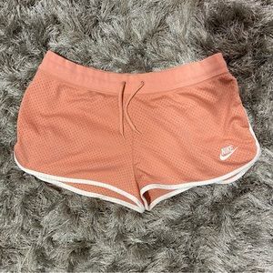 Nike women peach and white drawstring waist lined running shorts. Size L. Used.